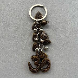 Cute Om and jingle bell Keychain